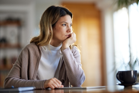 contemplative woman looking out the window
