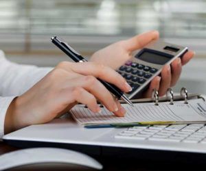 Woman using calculator