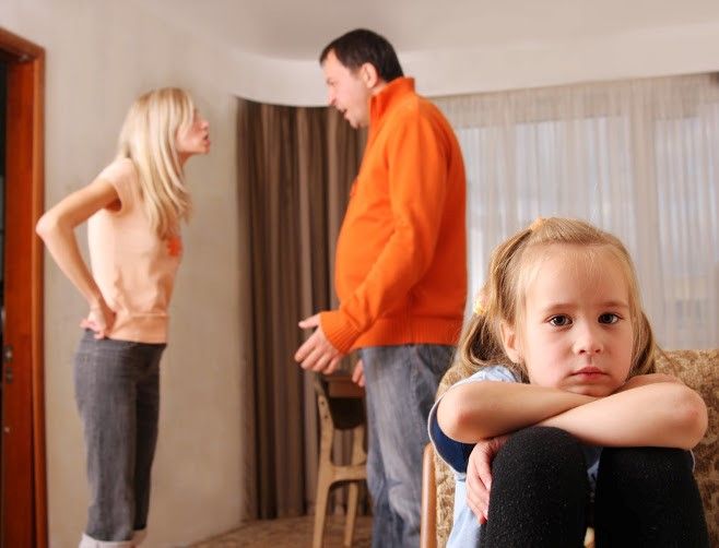 Parents arguing in front of child