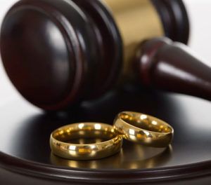 Wedding rings on mallet in courtroom