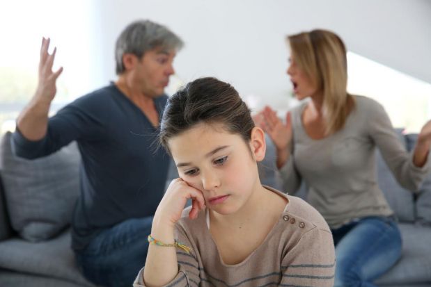 Parents arguing in front of child